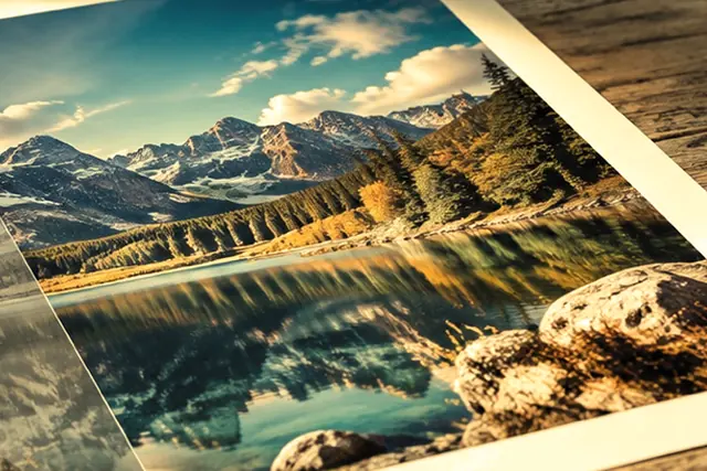A yellow-tinted photo of a lake print, with the tint removed in one press